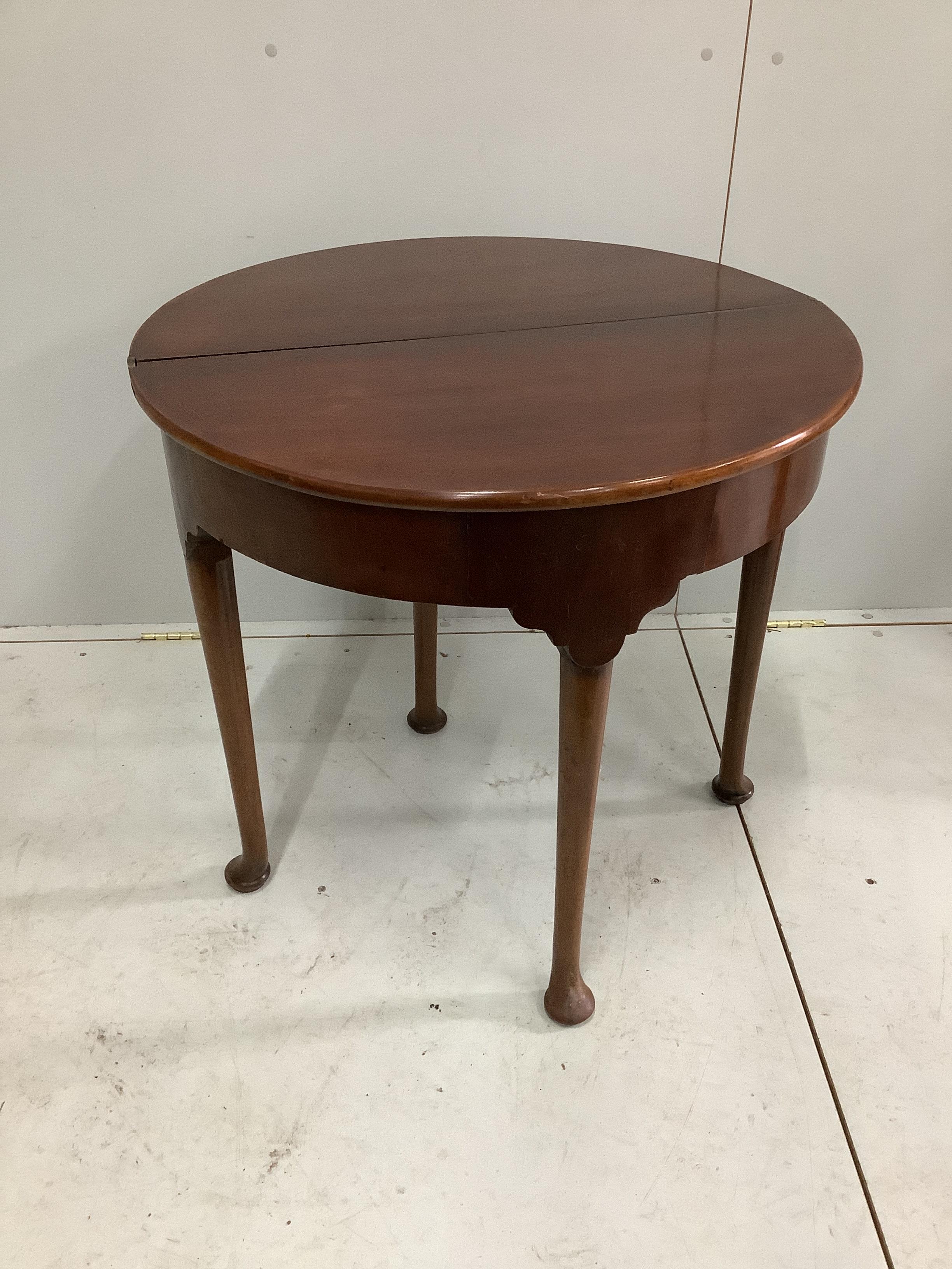 A George III mahogany D shaped folding tea table, width 74cm, depth 37cm, height 72cm